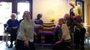 knitters all sitting with chair
