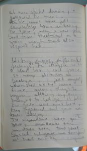 sketchbook with pencil handwriting