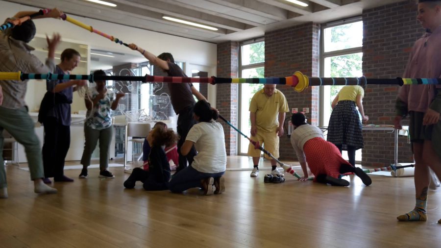 People playing with knitted ropes