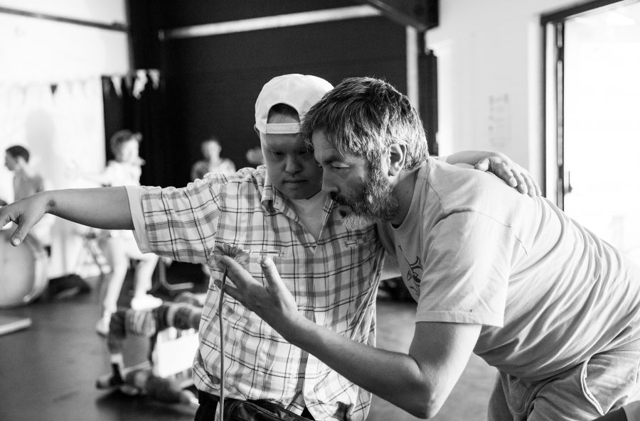 man dances with young man