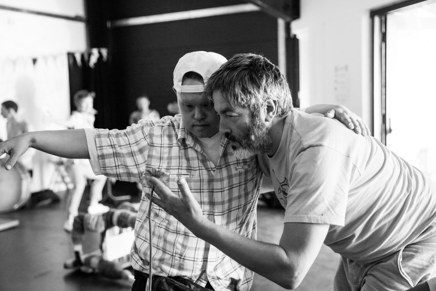 man dances with young man