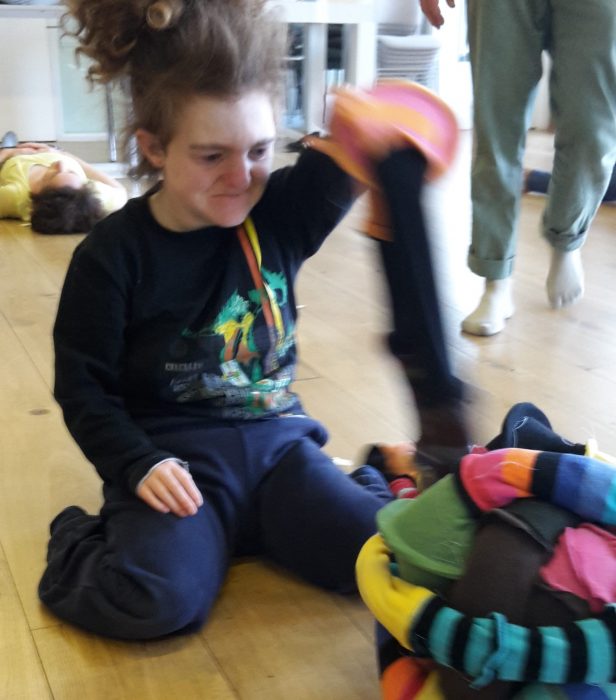 participant with a knitted sculpture