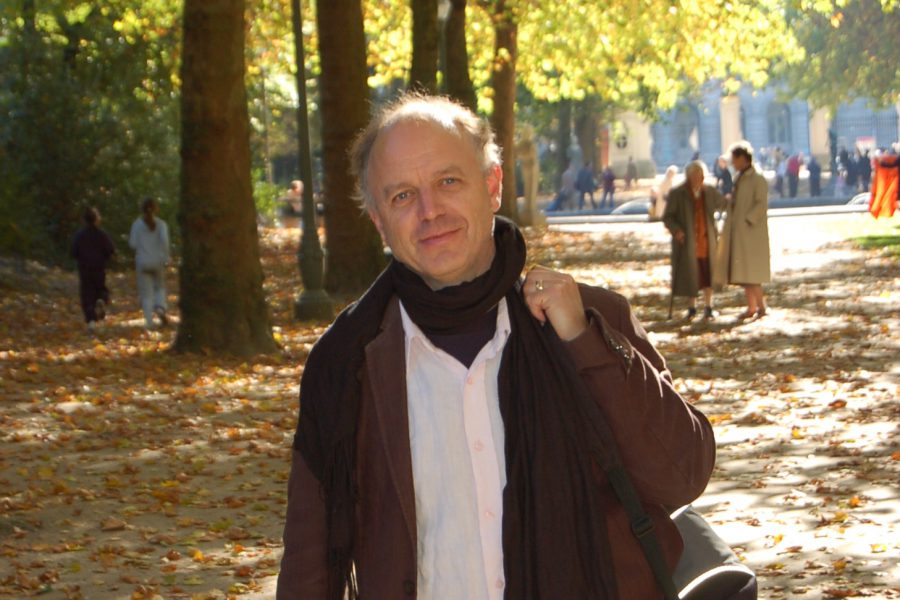 David standing in a park smiling