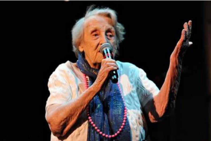 Older woman singing with microphone