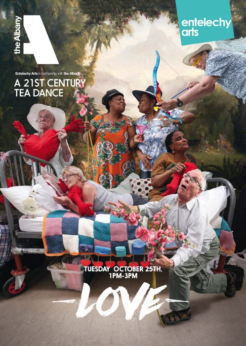 Six people in costumes posing around a bed.
