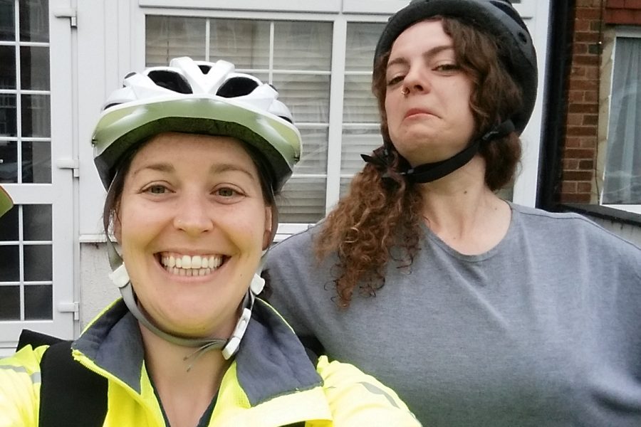 two women in cycling helmets