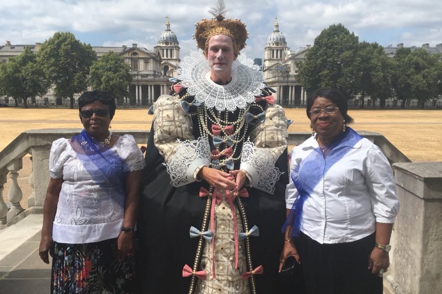 Man dressed as Elizabeth I and 2 women