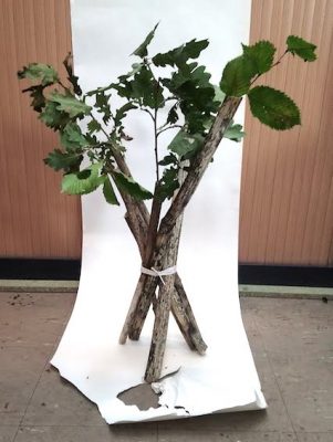 tree branches made into a vase shape