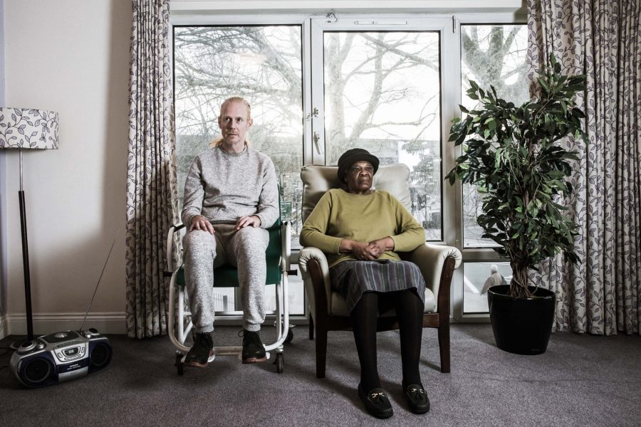 artist Chris Green with a woman in a home