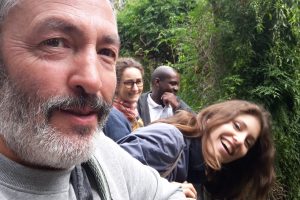 Group of people looking at camera in woods