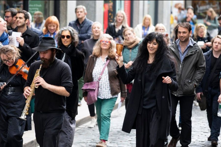 a group of people walking in the street