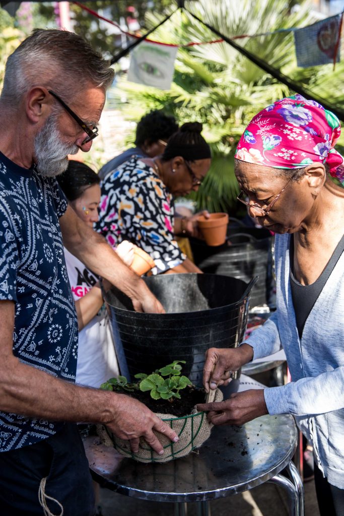 man and woman gardening