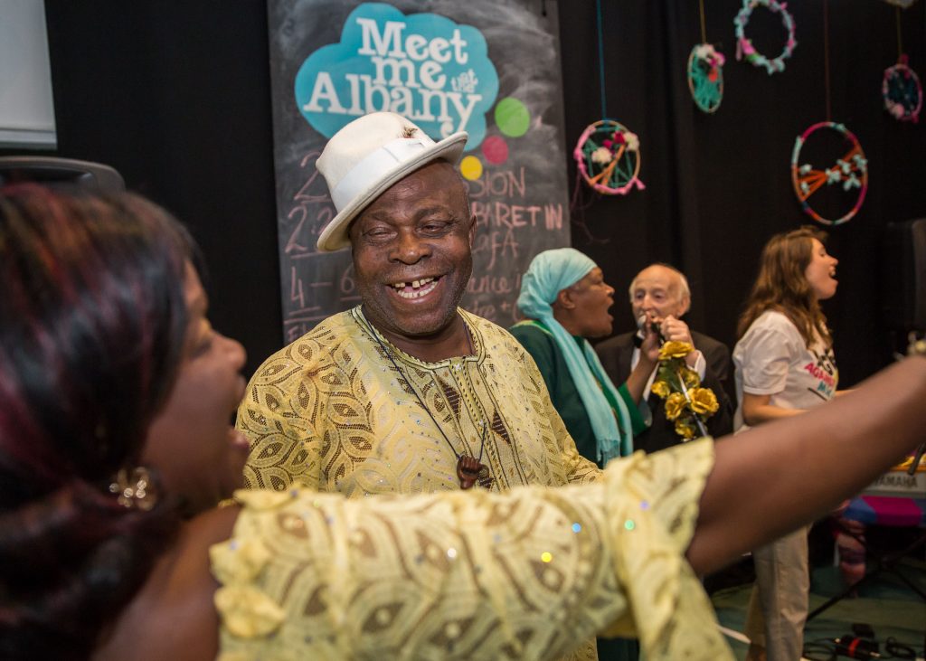 people dressed up having fun at the arts event