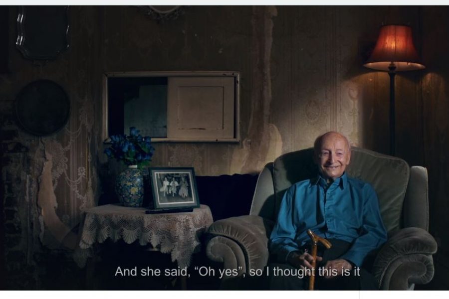 man sitting on sofa