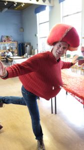 man in red jumper and hat dancing