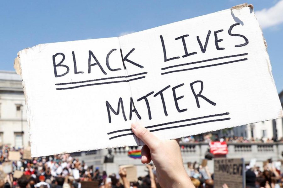 Black Lives Matter handwritten on plackard