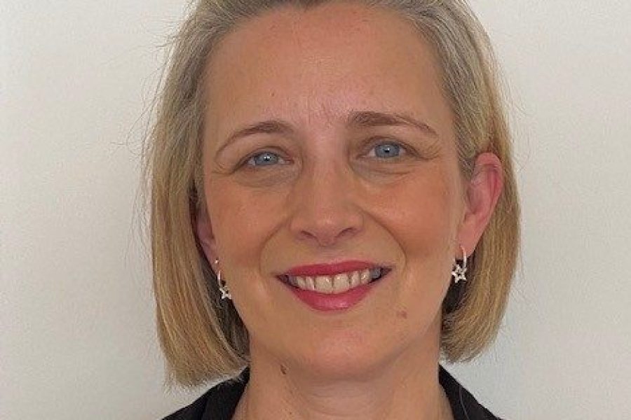 A portrait of Alison, a white woman with short light hair